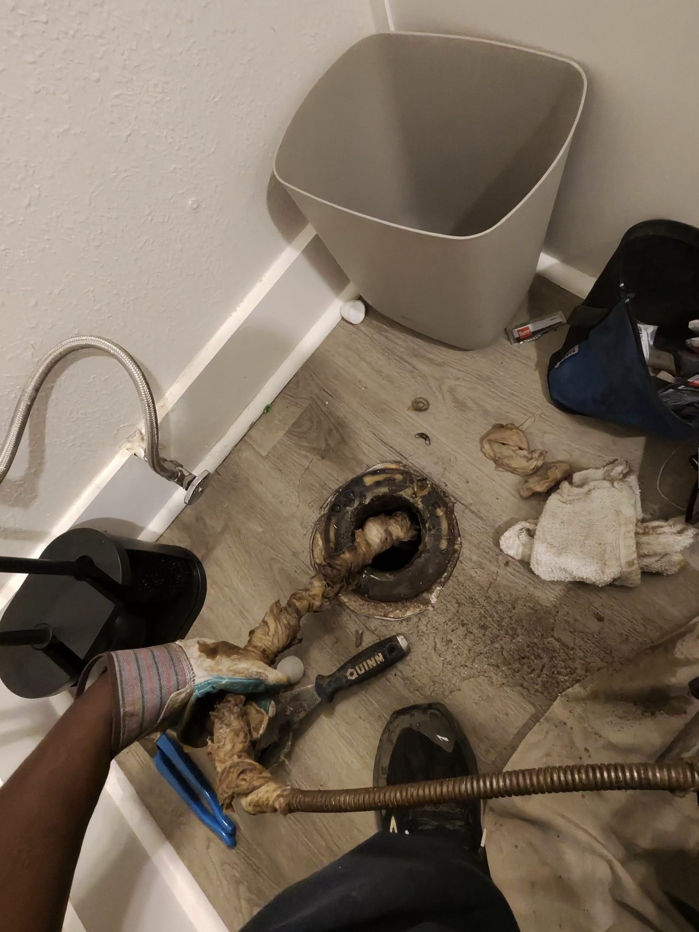 G&R technician fitting new sewer pipe in a trench